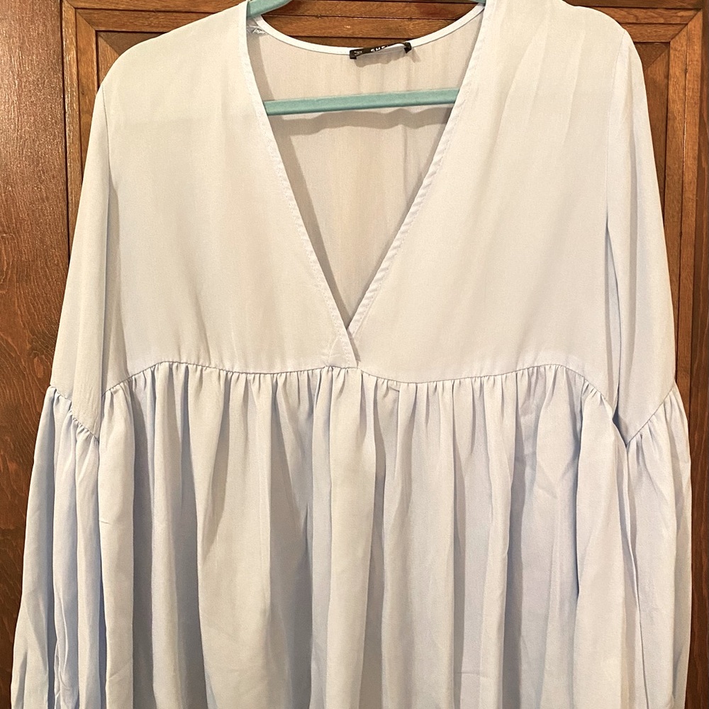 Light blue flow-y top